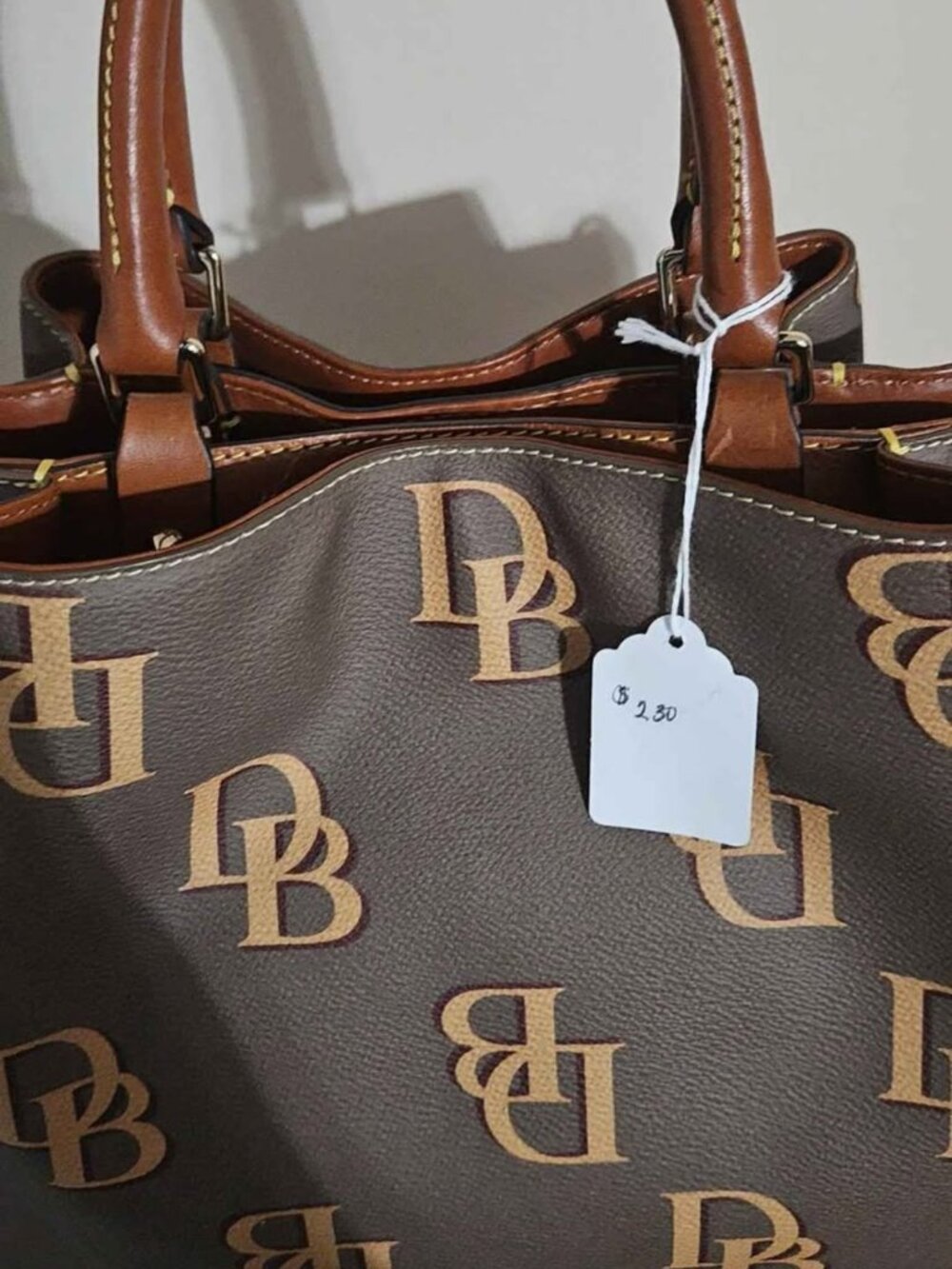 Classic Dooney & Bourke tote satchel featuring the iconic "DB" monogram pattern